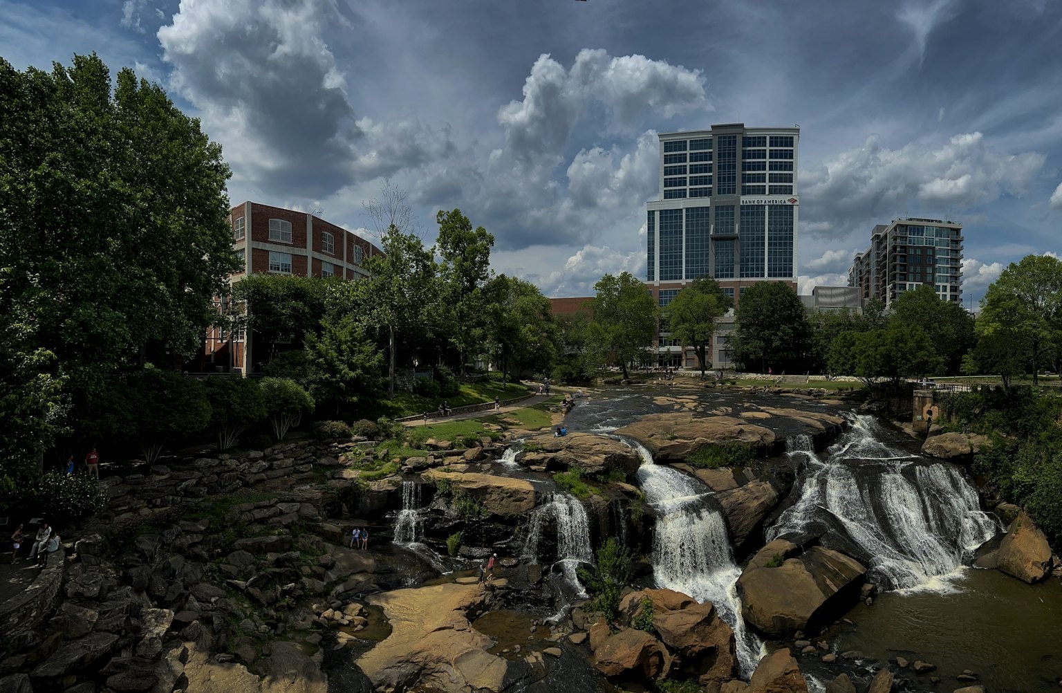 Falls Park on the Reedy River with the downtown Greenville, South Carolina skyline