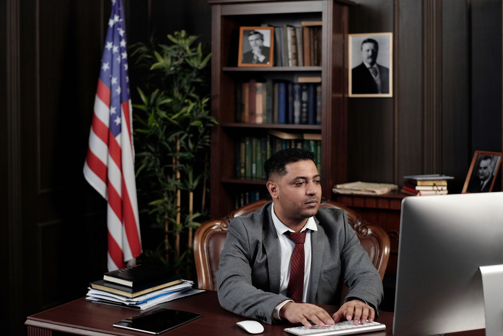 A lawyer working at a computer in a law office