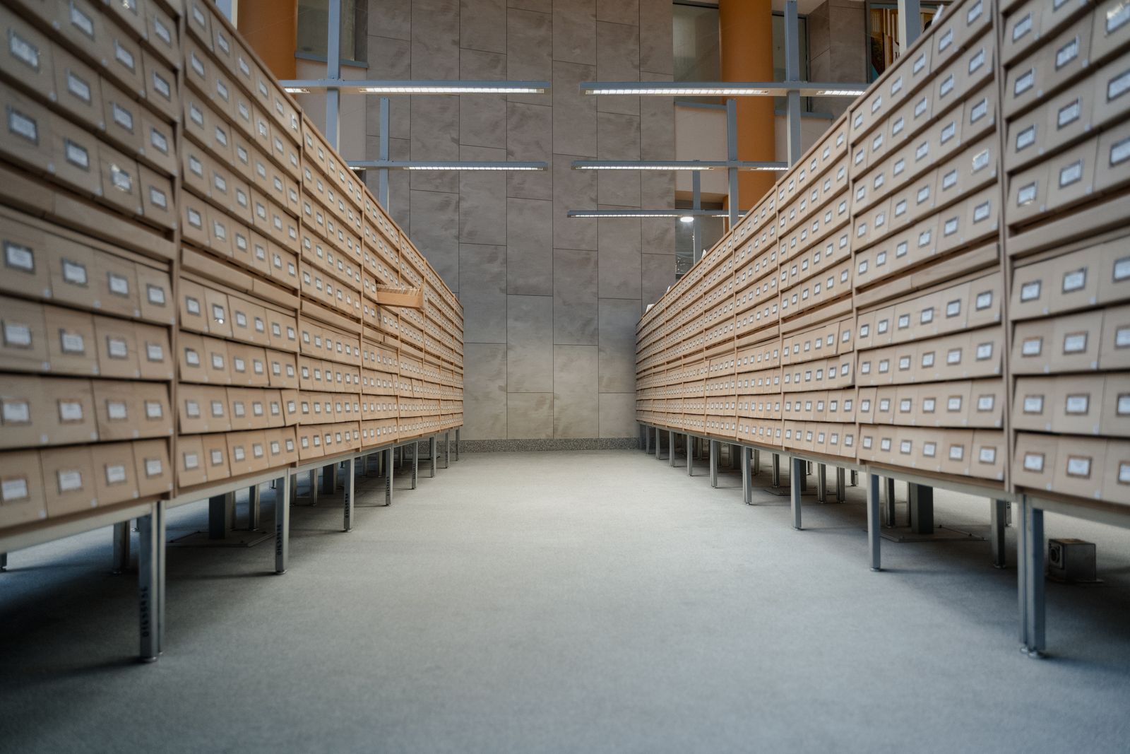 Rows of labeled case-file record drawers in a law-office archive